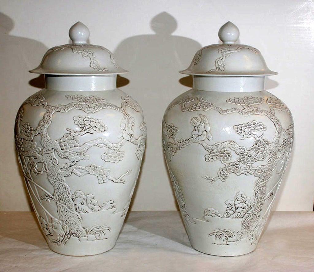 OF BALUSTER FORM, WITH OVERALL RELIEF DECORATION DEPICTING FLOWERING TREES.
